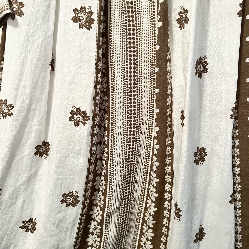 A Dainty Jewels dress with tags.